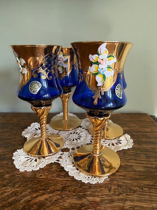 Set of 4 Murano cobalt blue and gold Venetian glass goblets with enamel floral decoration.