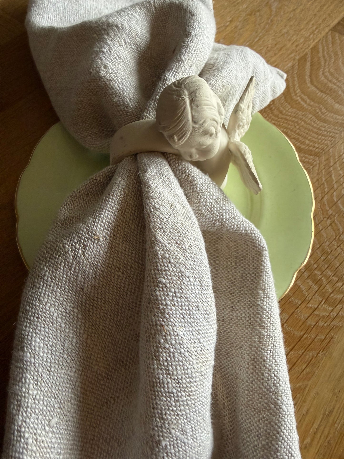Set of 4 cherub napkin rings.