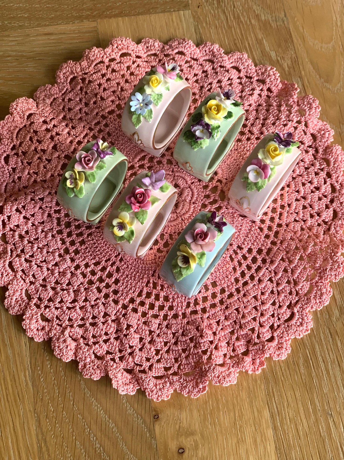 Antique, last century fine bone china, floral napkin rings.