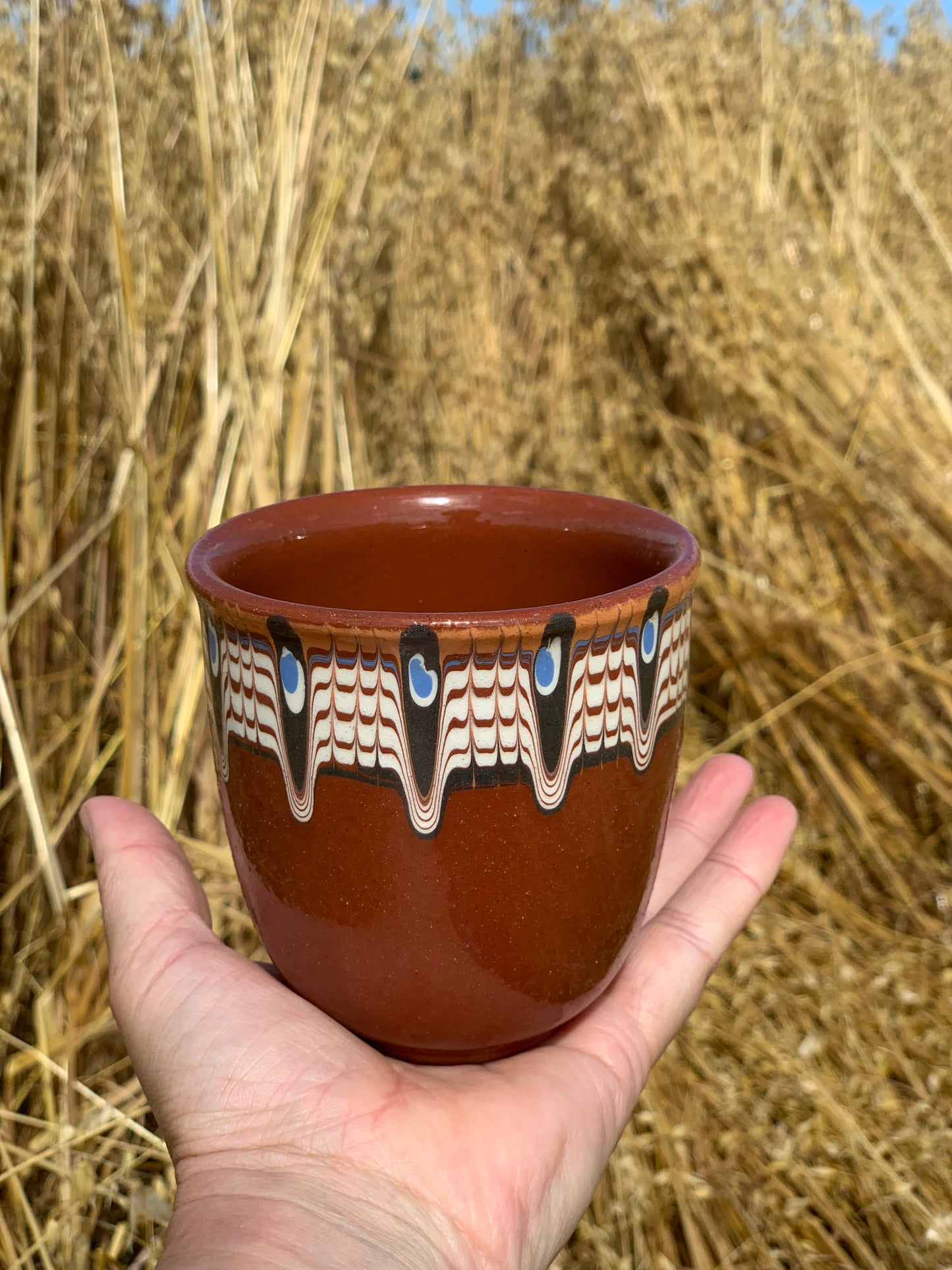 Hand thrown and hand painted, ceramic cups.