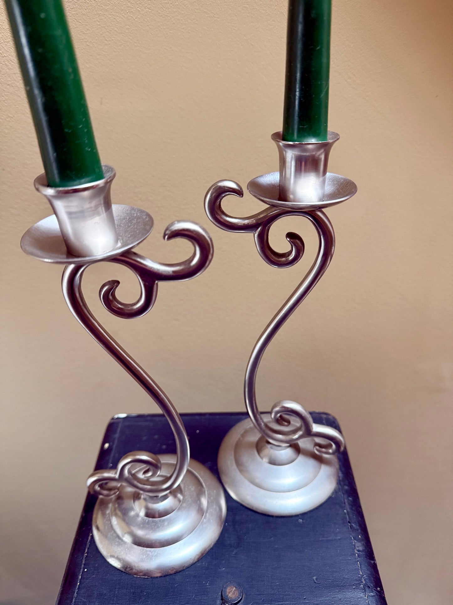 Vintage elegant white metal candlestick holders.