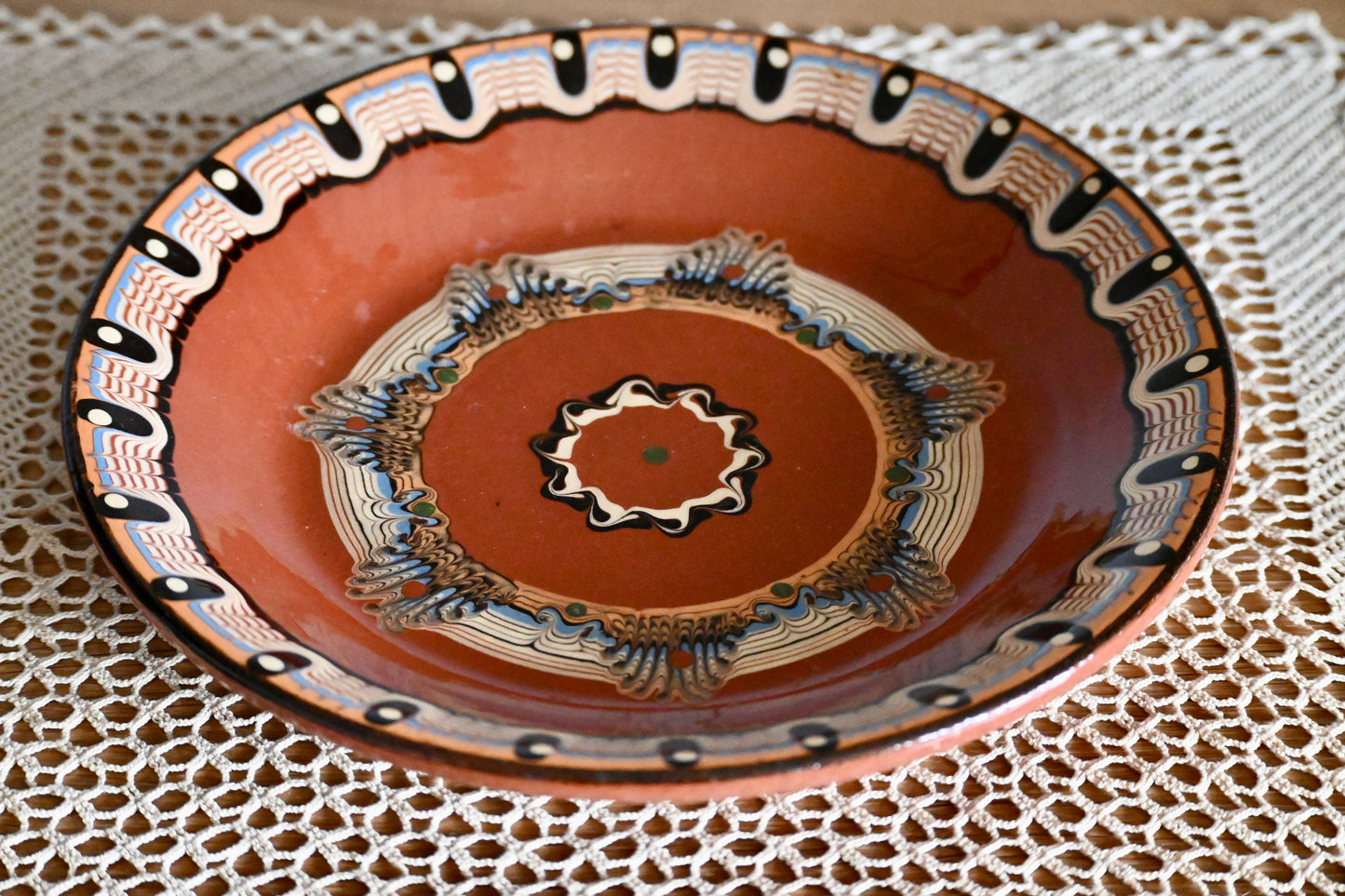 Vintage, handmade terracotta wall plate.