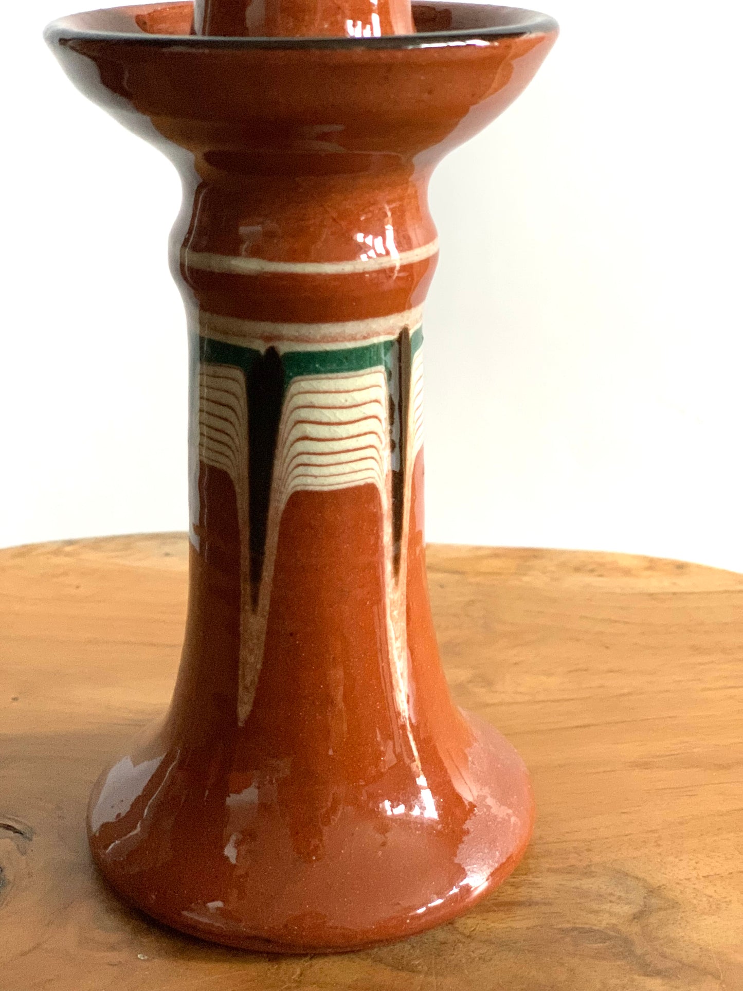 Vintage, handmade and hand painted terracotta candlestick.