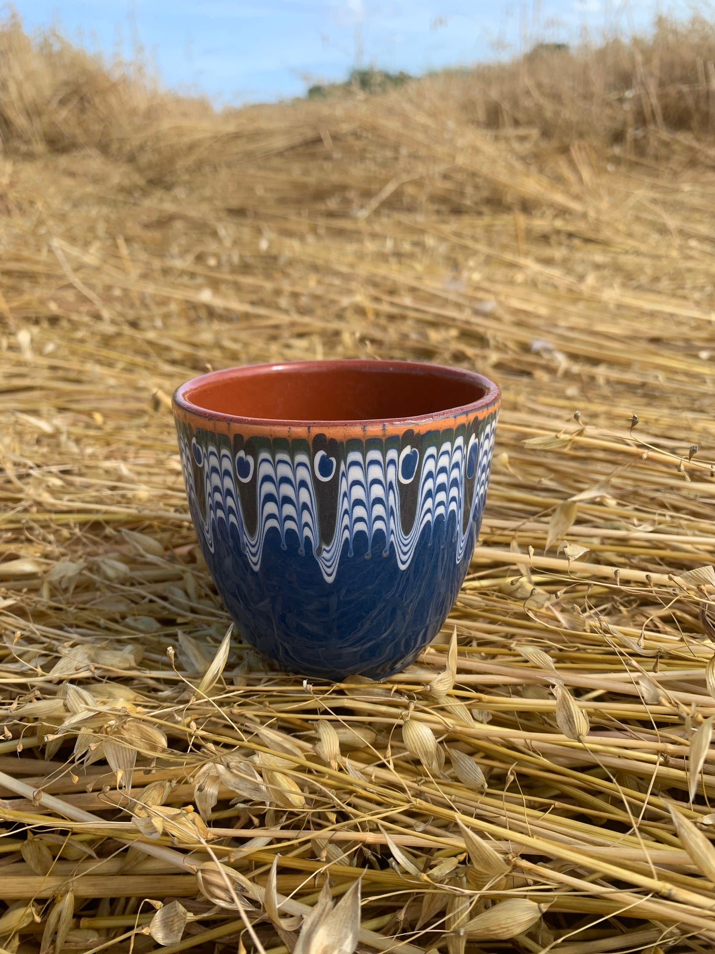 Hand thrown and hand painted, ceramic cups.