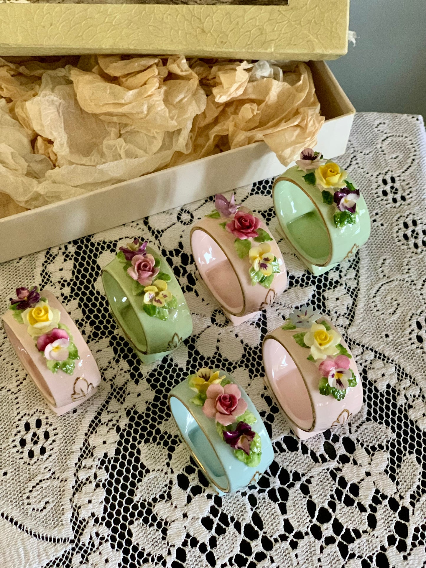 Antique, last century fine bone china, floral napkin rings.