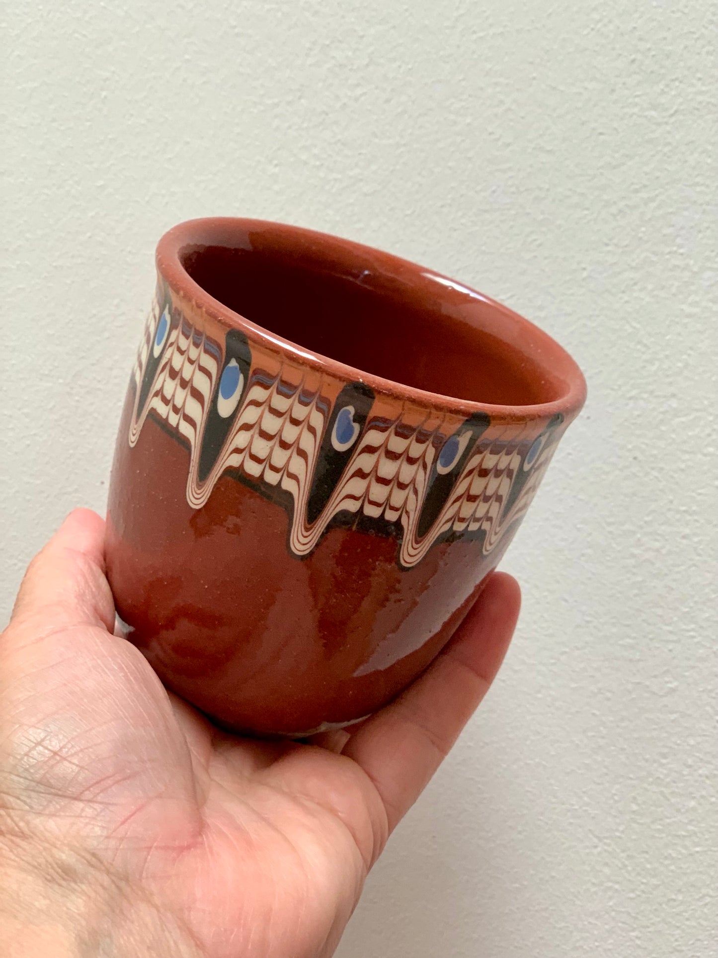 Hand thrown and hand painted, ceramic cups.