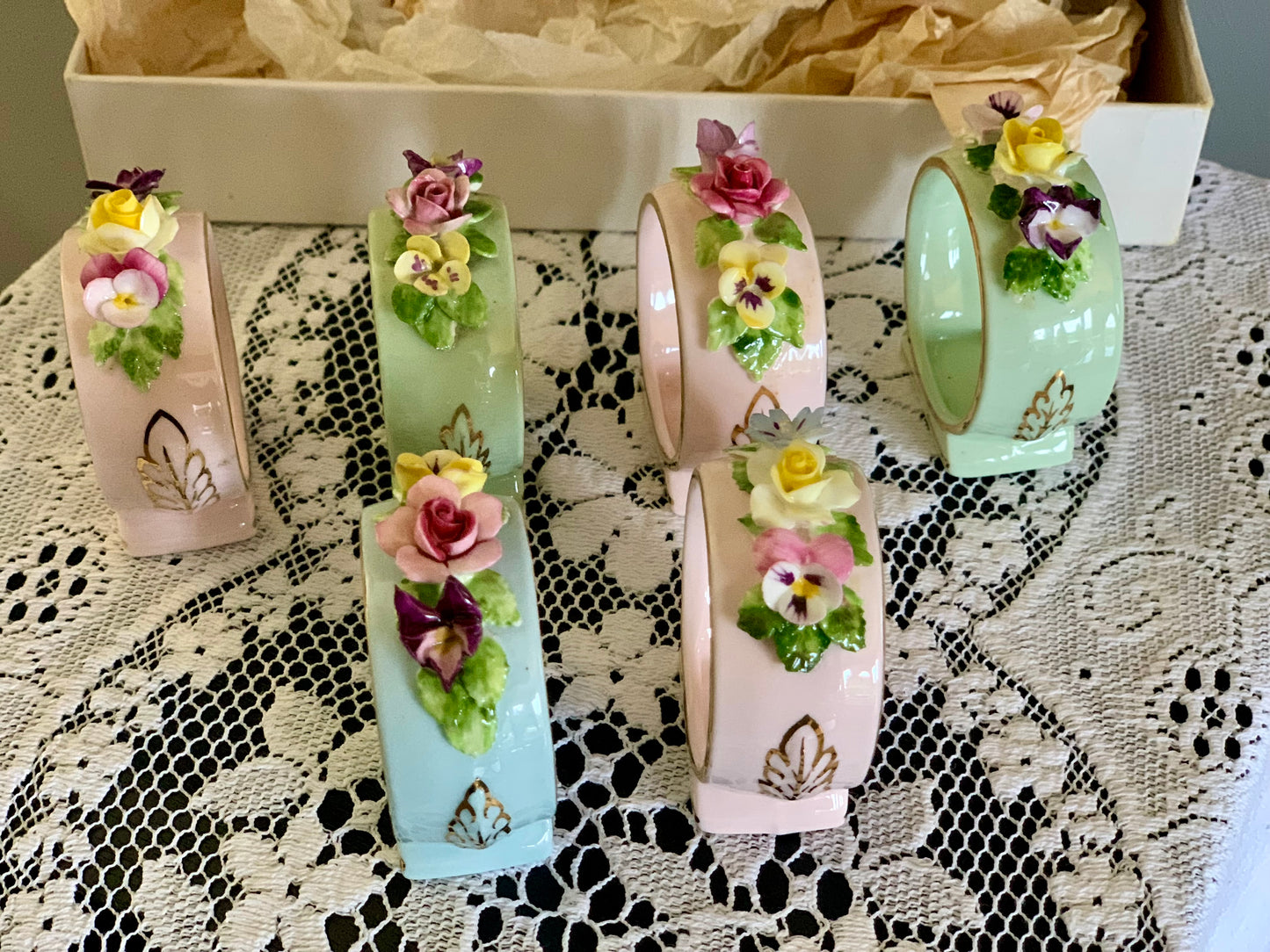 Antique, last century fine bone china, floral napkin rings.