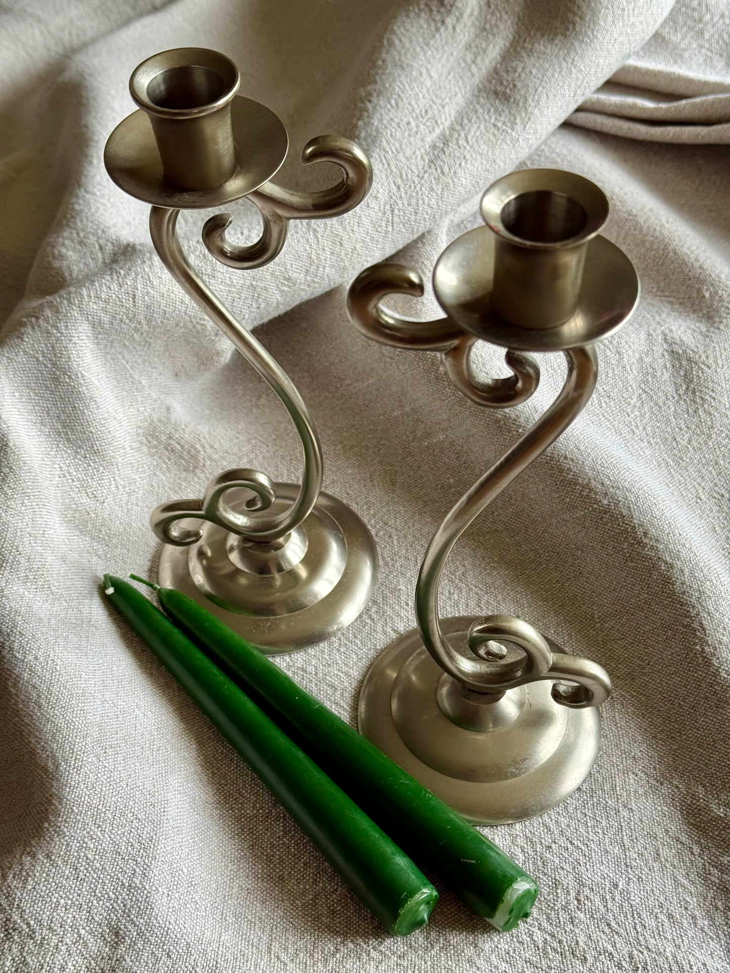 Vintage elegant white metal candlestick holders.