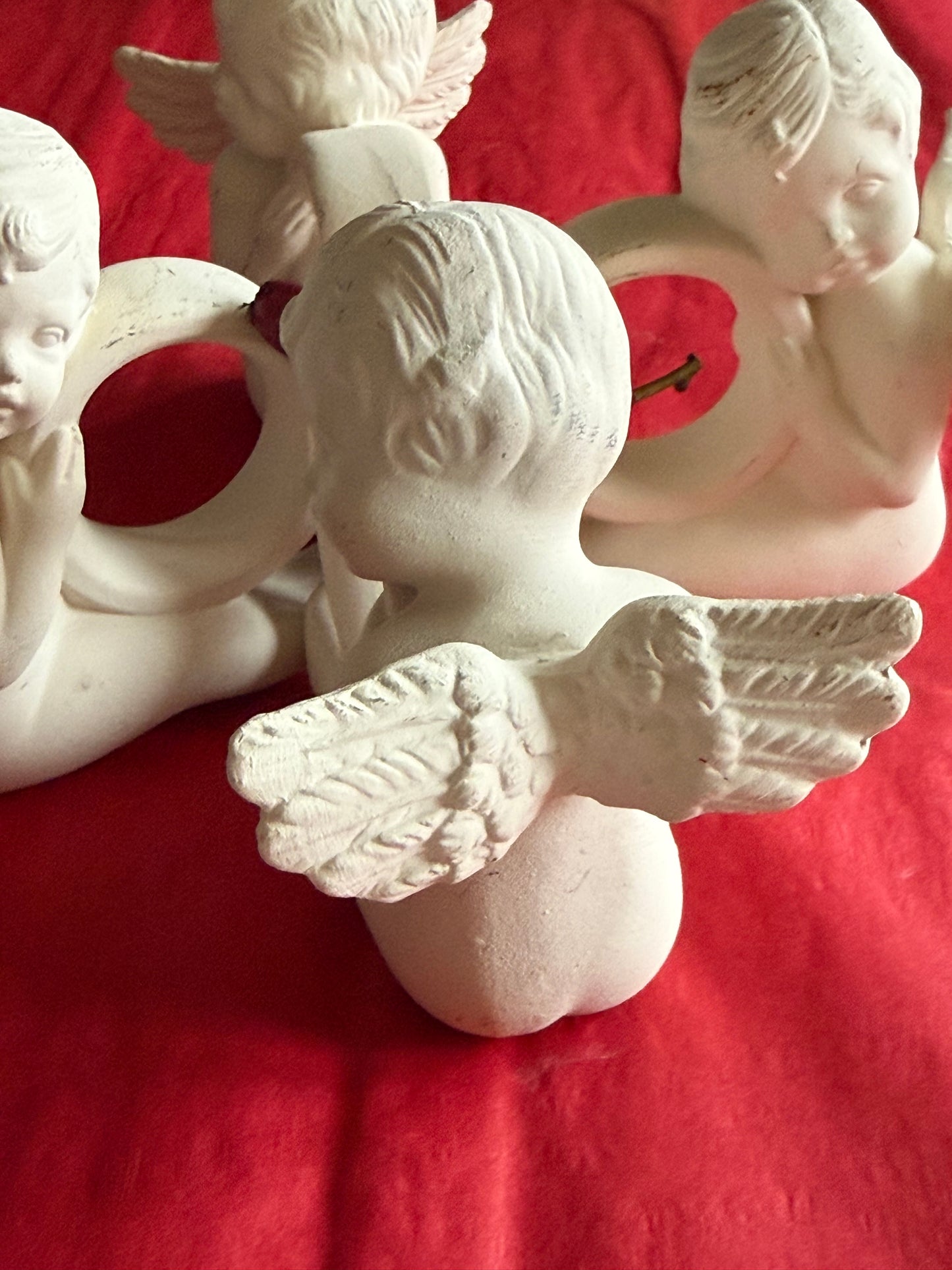 Set of 4 cherub napkin rings.