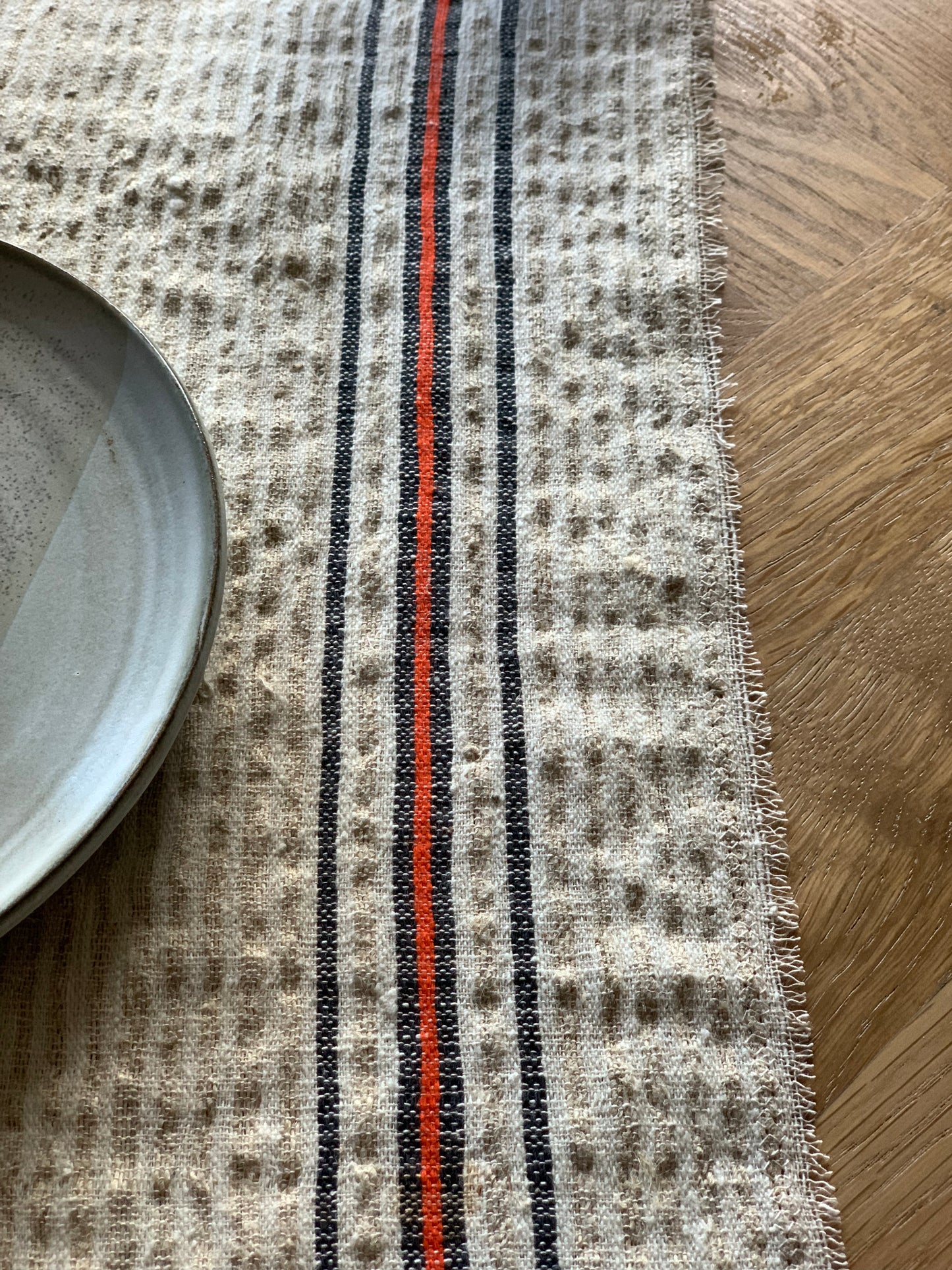 Set of four antique, handwoven place mats.