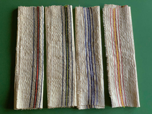 Set of four antique, handwoven place mats.