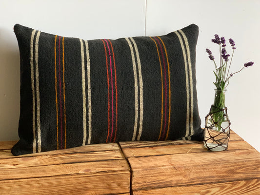 Antique, handwoven wool cushion.