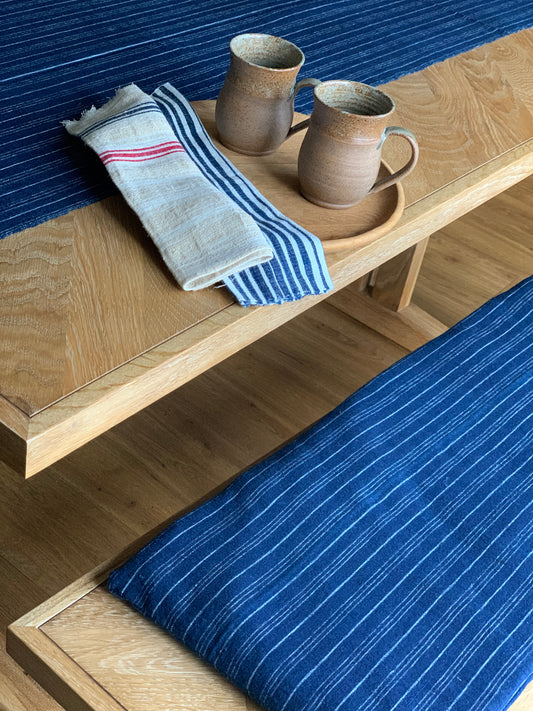 Antique, handwoven bench seat pad.